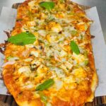 Naan Pizza Flatbread with traditional pizza sauce (Paneer or Chicken)